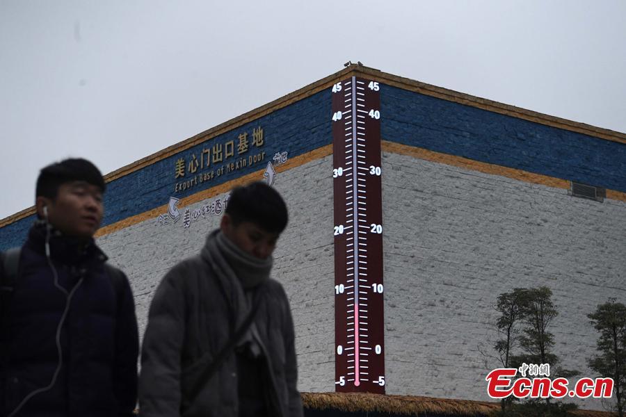<?php echo strip_tags(addslashes(A 11-meter-high outdoor thermometer is put into use at a museum in Chongqing’s Liangjiang New Area, the first national level development area in inland China, Jan. 3, 2019. The LED display shows temperatures real time using data collected from sensors. (Photo: China News Service/Chen Chao))) ?>