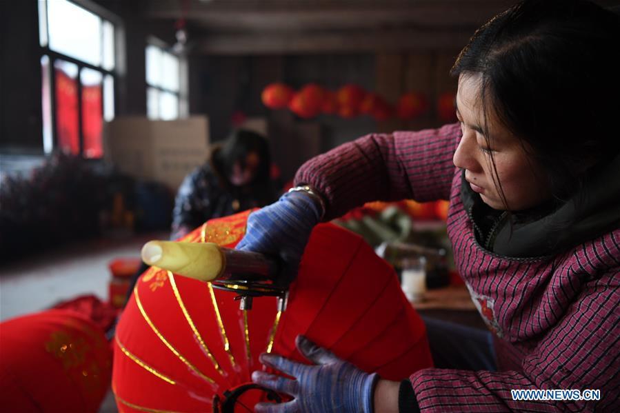 <?php echo strip_tags(addslashes(A villager works in a lantern workshop for the upcoming peak sales season of Spring Festival in Jifeng Town of Jishan County in Yuncheng, north China's Shanxi Province, Jan. 3, 2019. (Xinhua/Yang Chenguang))) ?>