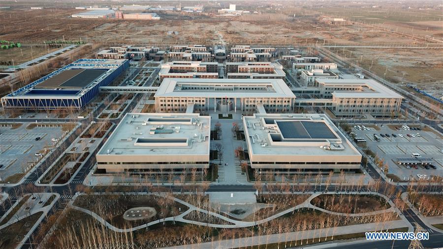 Aerial photo taken on Dec. 7, 2018 shows the Xiongan public services center in Xiongan New Area, north China\'s Hebei Province. China\'s central authorities have approved the 2018-2035 master plan for Xiongan New Area, stressing that its creation is significant to high-quality development and the building of the modern economic system. The plan was approved by the Central Committee of the Communist Party of China (CPC) and the State Council. The master plan is the fundamental guideline for the development, construction and management of the Xiongan New Area and should be strictly implemented, according to the approval released on Wednesday. The plan also lists overall development goals for the new area. By 2035, Xiongan will basically develop into a modern city that is green, intelligent and livable, with relatively strong competitiveness and harmonious human-environment interaction. (Xinhua/Yang Shiyao)