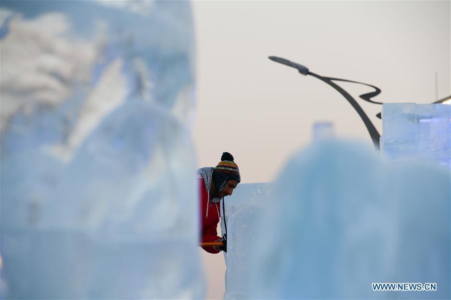 A contestant carves an ice sculpture during an international ice sculpture competition in Harbin, capital of northeast China\'s Heilongjiang Province, Jan. 3, 2019. (Xinhua/Wang Song)