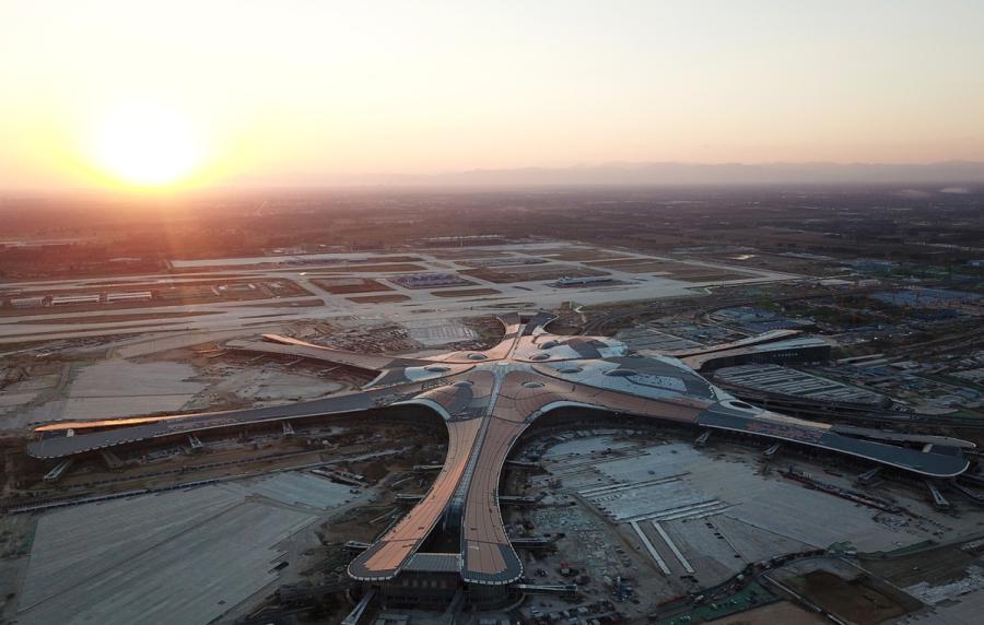 <?php echo strip_tags(addslashes(An aerial photo shows the construction site of Beijing's new airport in Daxing district in Beijing, Oct 2, 2018. (Photo/Xinhua)<br><br>

Passengers traveling through Beijing Capital International Airport exceeded 100 million in 2018, according to the General Administration of Civil Aviation, which is close to its limit.<br><br>

The administration predicted that passenger numbers through the capital will reach 150 million by 2025.<br><br>

The new airport-with four runways and a 700,000 square meter terminal-will help to meet the demand and improve the global flight network. It is expected to be the world's largest.<br><br>

The airport is designed to handle 72 million passengers, 20 million metric tons of cargo and mail, and 620,000 takeoffs and landings annually by 2025. There are long-term plans to expand the passenger number to 100 million annually.<br><br>)) ?>