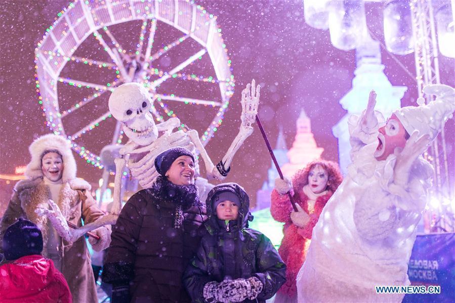 Visitors take photos in front of ice sculptures in Moscow, Russia, on Jan. 3, 2019. Moscow ice festival opened in Victory Park from Dec. 29, 2018 to Jan. 13, 2019. (Xinhua/Bai Xueqi)