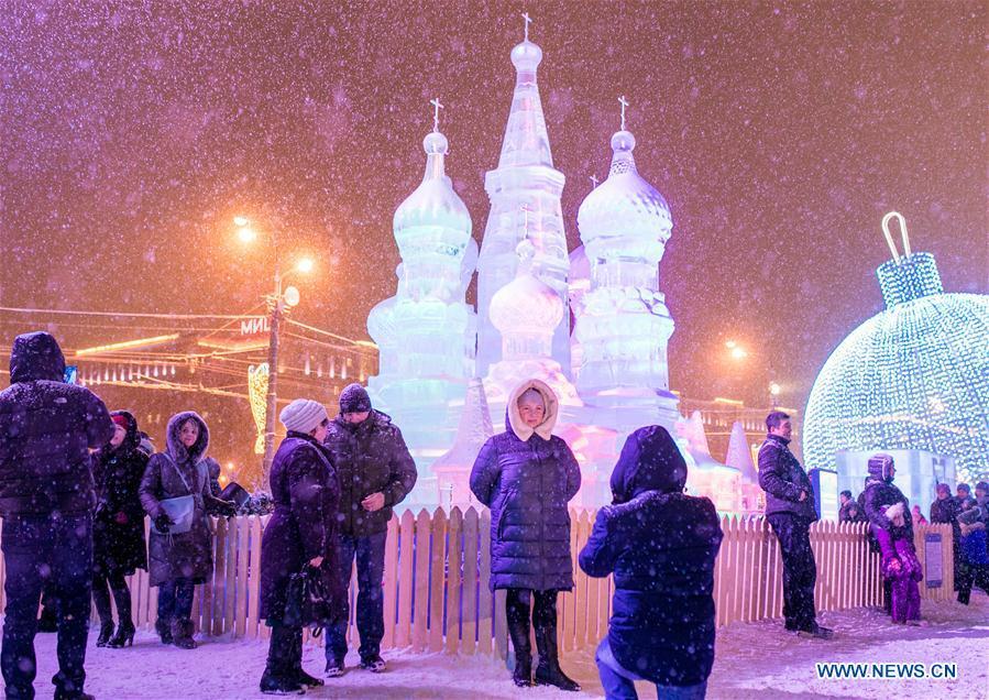 Visitors take photos in front of ice sculptures in Moscow, Russia, on Jan. 3, 2019. Moscow ice festival opened in Victory Park from Dec. 29, 2018 to Jan. 13, 2019. (Xinhua/Bai Xueqi)