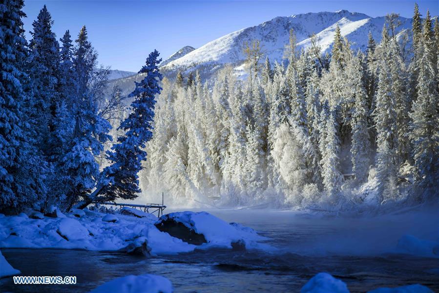 Photo taken on Jan. 2, 2019 shows scenery near the Kanas Lake in Kanas, northwest China\'s Xinjiang Uygur Autonomous Region. Kanas scenic spot attracts lots of visitors in winter with its pure snow scenery and various entertainment. (Xinhua/Zhao Ge)