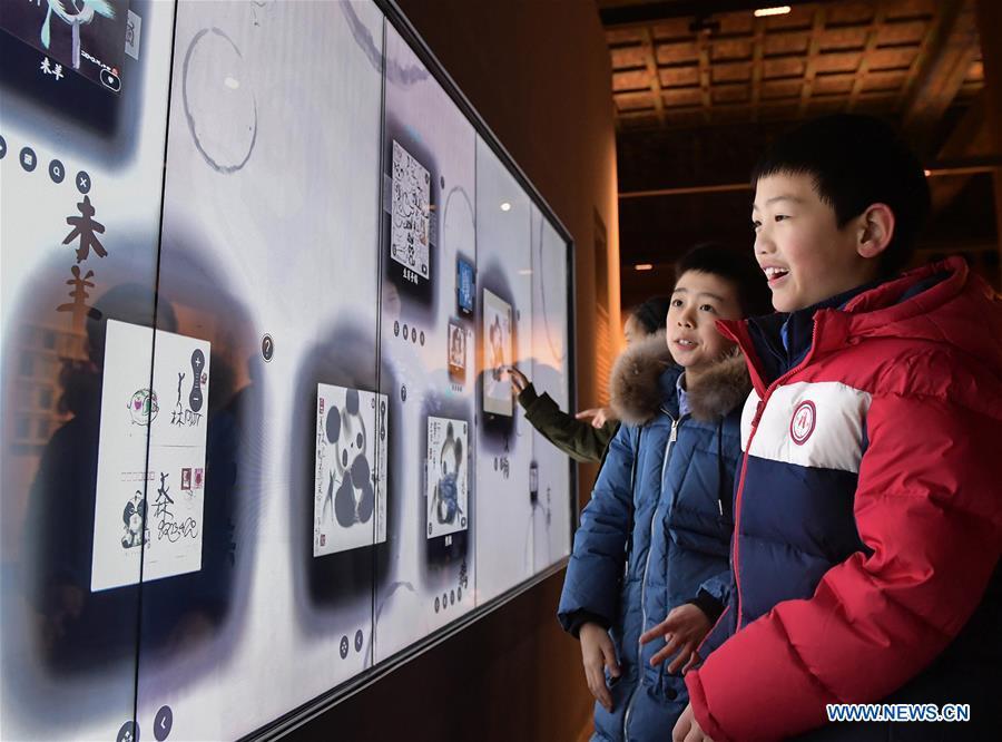 Visitors view Han Meilin\'s Chinese Zodiac Art Exhibition in Beijing, capital of China, Jan. 5, 2019. The Chinese Zodiac Art Exhibition, displaying the fine arts of Chinese artist Han Meilin, kicked off in the Palace Museum on Saturday and will last until Feb. 20, 2019. (Xinhua/Li He)