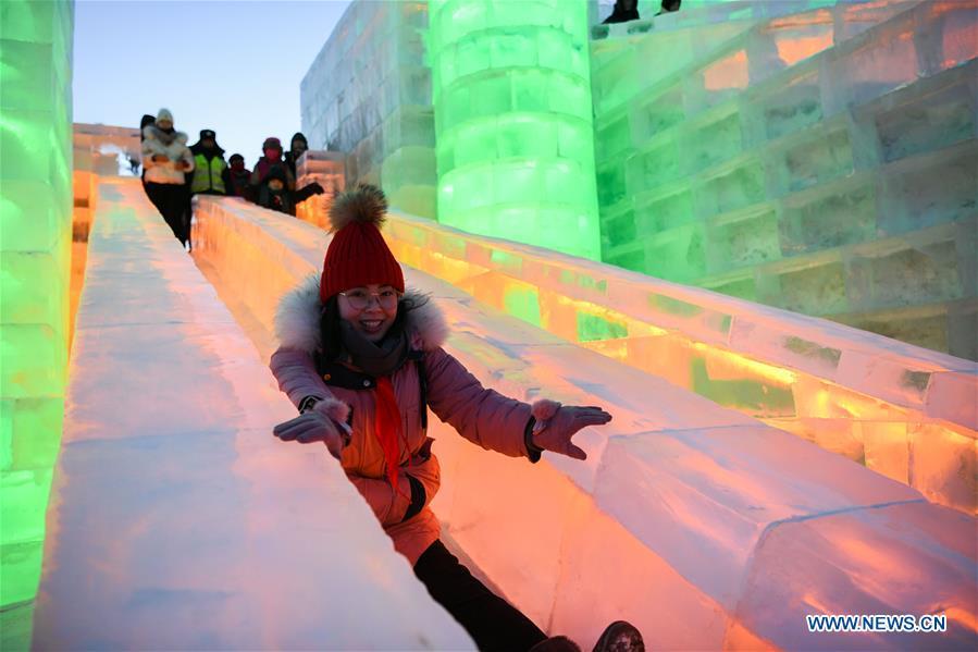 Tourists try ice slide at the Ice-Snow World in Harbin, capital of northeast China\'s Heilongjiang Province, Jan. 5, 2019. The 35th Harbin International Ice and Snow Festival kicked off here on Saturday. (Xinhua/Wang Song)