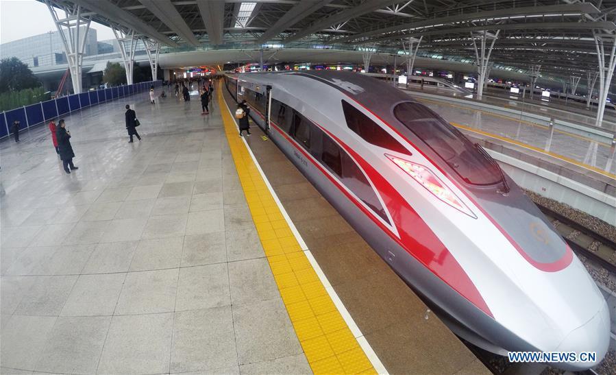 Photo taken on Jan. 5, 2019 shows a new Fuxing bullet train at Shanghai Hongqiao Railway Station in Shanghai, east China. A longer Fuxing bullet train started running on the Beijing-Shanghai line Saturday at noon. The new train, with a designed speed of 350 km per hour, has 17 carriages, one carriage longer than the Fuxing trains currently in use. (Xinhua/Fang Zhe)