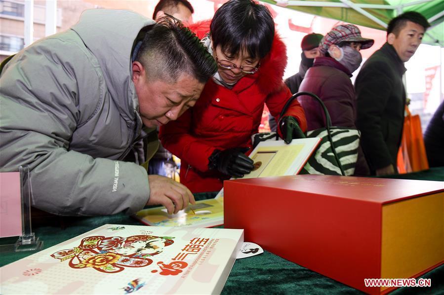 Citizens purchase special zodiac stamps for the lunar year of the Pig in Yinchuan, capital of Ningxia Hui Autonomous Region, Jan. 5, 2019. China Post on Saturday issued a set of special zodiac stamps in honor of 2019 Chinese Lunar New Year, or the Year of the Pig. The Year of the Pig starts from Feb. 5, 2019. (Xinhua/Feng Kaihua)