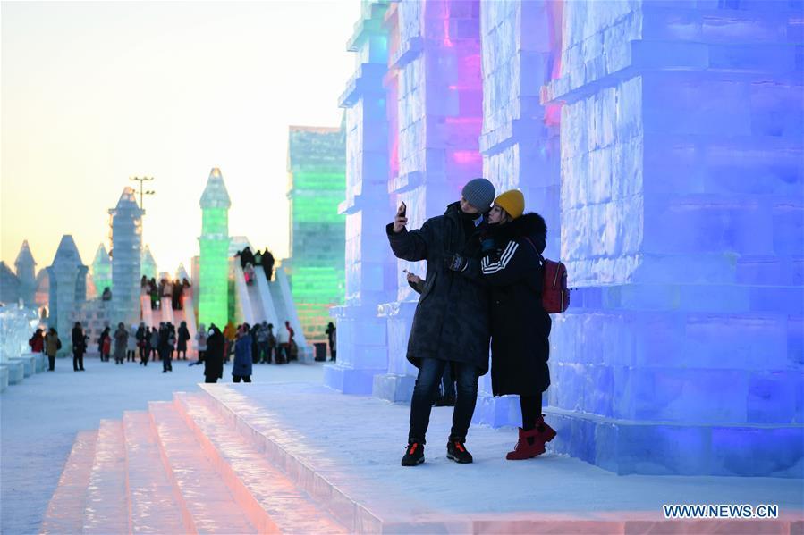 Tourists take selfies at the Ice-Snow World in Harbin, capital of northeast China\'s Heilongjiang Province, Jan. 5, 2019. The 35th Harbin International Ice and Snow Festival kicked off here on Saturday. (Xinhua/Wang Song)