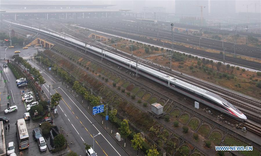 Photo taken on Jan. 5, 2019 shows a new Fuxing bullet train running on the Beijing-Shanghai line arriving at Nanjing South Railway Station in Nanjing, east China\'s Jiangsu Province. A longer Fuxing bullet train started running on the Beijing-Shanghai line Saturday at noon. The new train, with a designed speed of 350 km per hour, has 17 carriages, one carriage longer than the Fuxing trains currently in use. (Xinhua/Su Yang)
A longer Fuxing bullet train started running on the Beijing-Shanghai line Saturday at noon.
The new train, with a designed speed of 350 km per hour, has 17 carriages, one carriage longer than the Fuxing trains currently in use.
Measuring 439.9 meters long and with a seating capacity of 1,283 people, the 17-carriage train can be used with existing stations, platforms and other high-speed railway facilities.
The Fuxing bullet trains first made its debut in June 2017, and the 16-carriage trains were put into operation in July 2018.
Entirely designed and manufactured in China, the Fuxing, or Rejuvenation, trains are more spacious and energy-efficient, with a longer service life and better reliability than previous models.