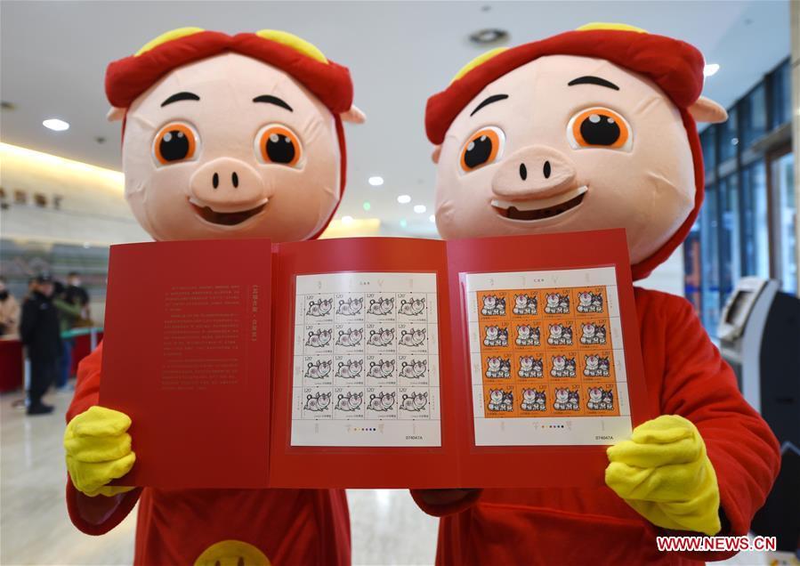 Special zodiac stamps for the lunar year of the Pig are displayed in Nanjing, capital of east China\'s Jiangsu Province, Jan. 5, 2019. China Post on Saturday issued a set of special zodiac stamps in honor of 2019 Chinese Lunar New Year, or the Year of the Pig. The Year of the Pig starts from Feb. 5, 2019. (Xinhua/Sun Can)