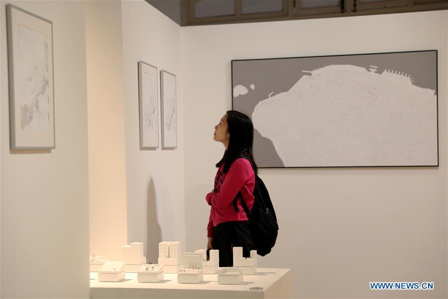 A visitor views exhibits during the \