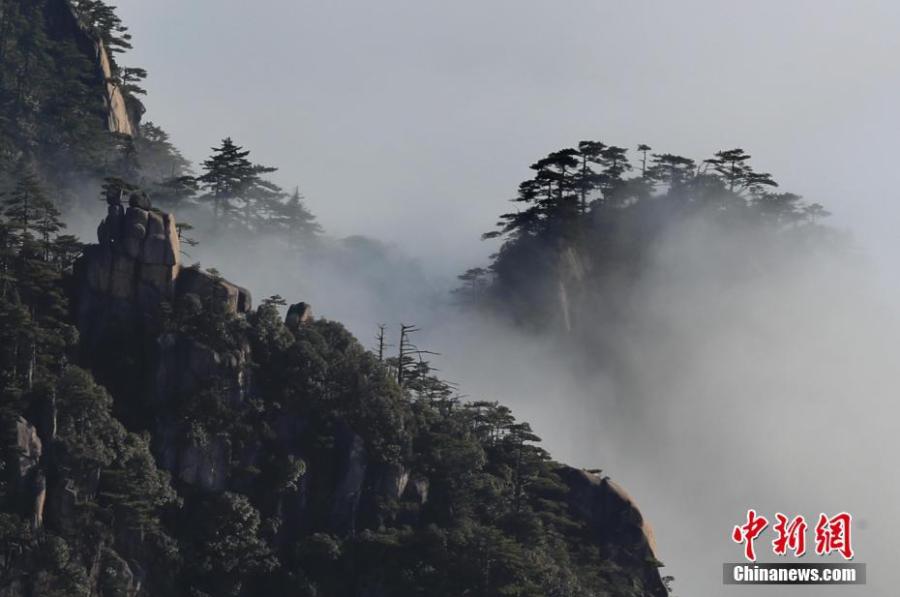 A sea of clouds after rain sweeps over Mount Huangshan in Anhui Province on Jan. 6, 2018. A UNESCO World Heritage site, the area is well known for its scenery, sunsets, peculiarly-shaped granite peaks, and pine trees. (Photo: China News Service/Shi Guangde)