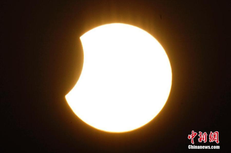 A partial solar eclipse is observed in Tianjin, Jan. 6, 2019. (Photo: China News Service/Tong Yu)