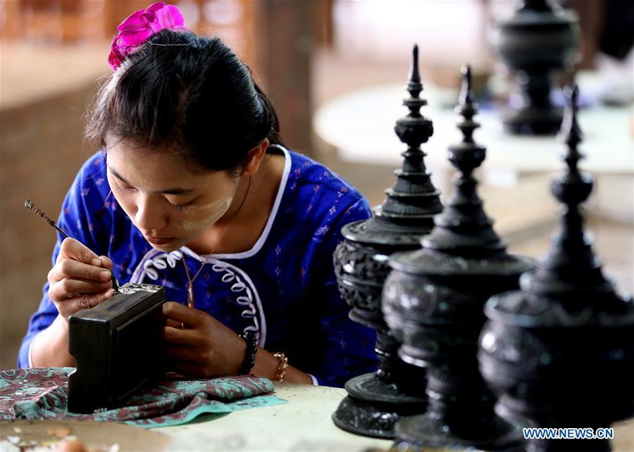 A worker makes lacquerware at a workshop in Bagan, Mandalay Region of Myanmar, on Jan. 7, 2019. Lacquerware is one of Myanmar\'s traditional handicrafts and popular souvenirs for tourists. It is made of strips of bamboo, hair of horse tail and wood. (Xinhua/U Aung)