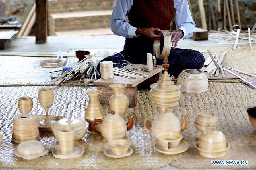 A worker makes lacquerware at a workshop in Bagan, Mandalay Region of Myanmar, on Jan. 7, 2019. Lacquerware is one of Myanmar\'s traditional handicrafts and popular souvenirs for tourists. It is made of strips of bamboo, hair of horse tail and wood. (Xinhua/U Aung)