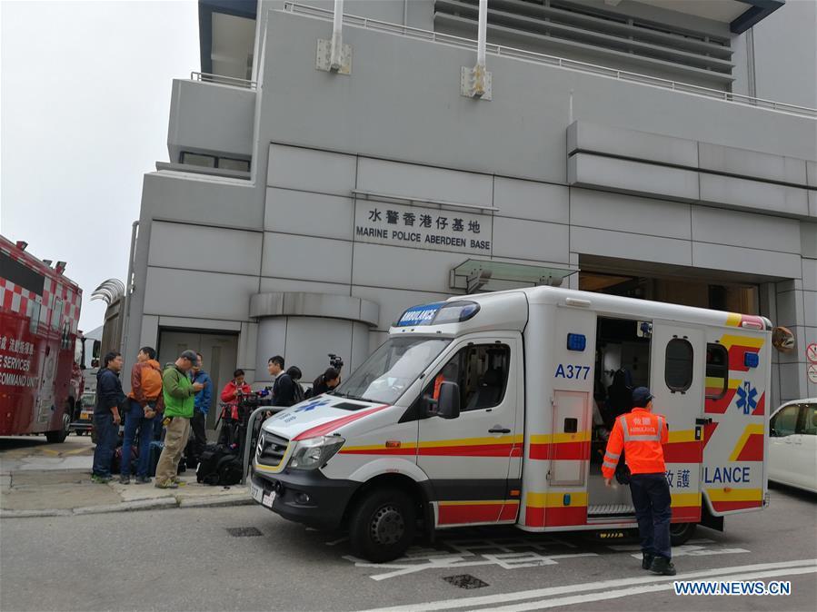 Rescuers and media workers are seen outside the Marine Police Aberdeen Base in Hong Kong, south China, Jan. 8, 2019. One person was killed, seven injured and two missing as an oil tanker exploded and caught fire Tuesday off Hong Kong\'s Lamma Island. The accident occurred at around 11:29 a.m. local time (0329 GMT) when crew members on the 140-meter-long oil tanker were trying to connect pipes with an oil barge to refuel the ship south off Lamma Island, said Yiu Men Yeung, division commander for marine and diving of Hong Kong Special Administrative Region (HKSAR) government\'s Fire Services Department (FSD). (Xinhua/Wu Xiaochu)
