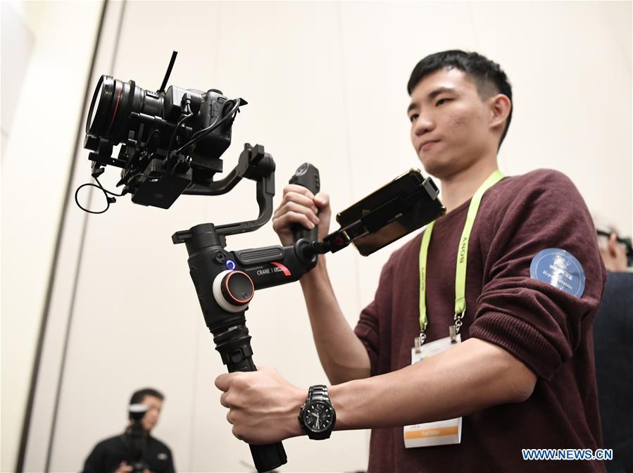 A new handheld gimbal is seen during a press preview held by members of the Chinese corps attending the 2019 Consumer Electronics Show (CES) in Las Vegas, the United States, Jan. 7, 2019. The 2019 Consumer Electronics Show (CES) opens on Tuesday. (Xinhua/Liu Jie)