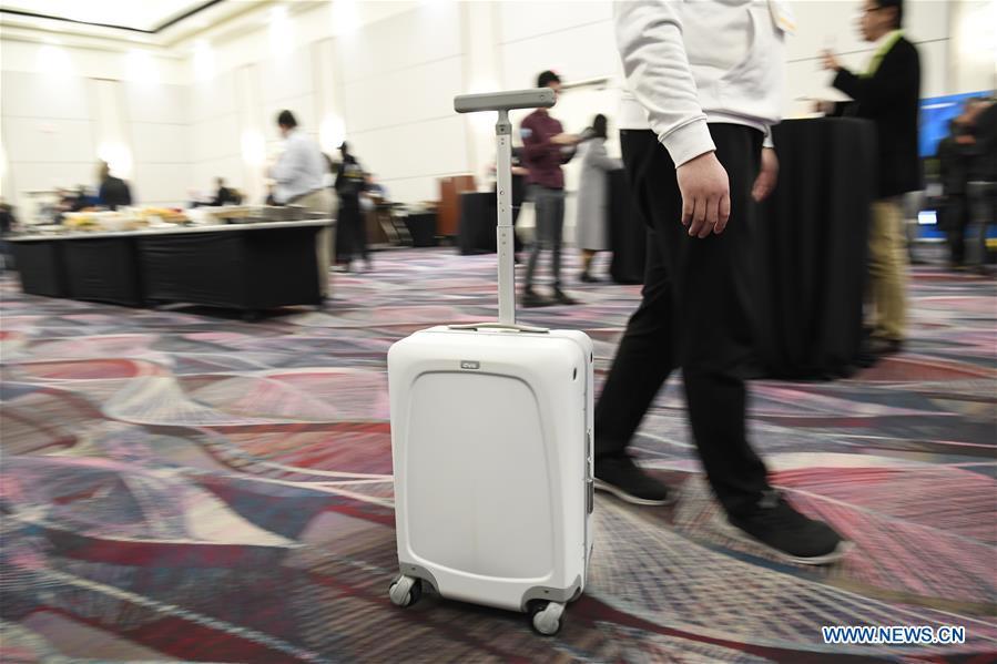 A smart carry-on suitcase is seen during a press preview held by members of the Chinese corps attending the 2019 Consumer Electronics Show (CES) in Las Vegas, the United States, Jan. 7, 2019. The 2019 Consumer Electronics Show (CES) opens on Tuesday. (Xinhua/Liu Jie)