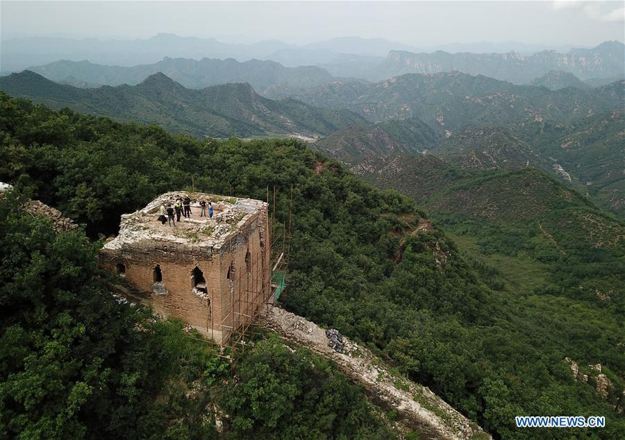 Aerial photo taken on Aug. 22, 2018 shows a section of the Great Wall constructed in the Ming Dynasty (1368-1644), north of Donggou Village in Miyun District of Beijing, capital of China. The National Cultural Heritage Administration will work out a plan to better protect cultural relics and speed up the creation of a safety oversight platform in 2019. Stressing the importance of such protection, Liu Yuzhu, head of the administration, said lax enforcement is a prominent problem that endangers cultural relics, at a meeting attended by cultural heritage administrators nationwide. (Xinhua/Luo Xiaoguang)