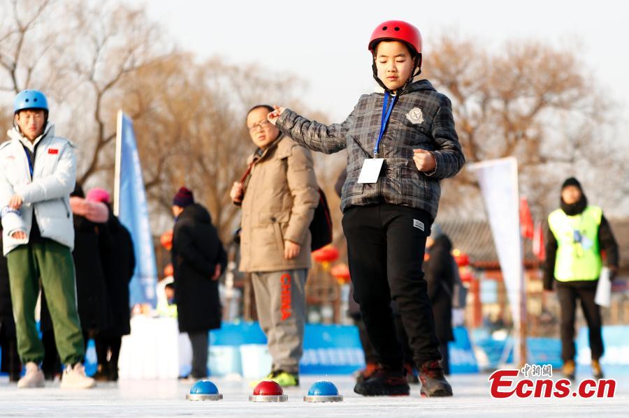 Players compete in cuju, an ancient Chinese football game, during the first Beijing Winter Games held at Houhai Ice Arena in Beijing, Jan. 10, 2019. More than 180 participants on 16 teams representing all districts in the capital city joined the competition. Playing cuju on ice has long been a traditional folk sport in Beijing. (Photo: China News Service/Fu Tian)