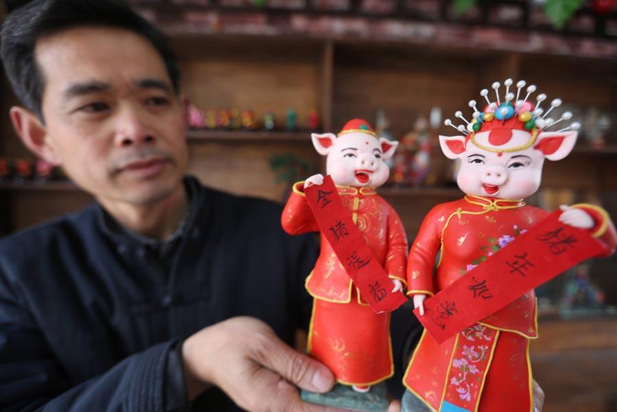 Dough figurines of pigs by craftsman Zuo Ansheng on Jan. 8, 2019. (Photo/Asianewsphoto)