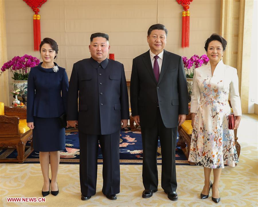 Xi Jinping (2nd R), general secretary of the Central Committee of the Communist Party of China and Chinese president, and his wife Peng Liyuan (1st R) pose for photos with Kim Jong Un (2nd L), chairman of the Workers\' Party of Korea and chairman of the State Affairs Commission of the Democratic People\'s Republic of Korea, and his wife Ri Sol Ju at Beijing Hotel in Beijing, capital of China, Jan. 9, 2019. Xi Jinping on Tuesday held talks with Kim Jong Un, who arrived in Beijing on the same day for a visit to China. On Wednesday, Xi Jinping met with Kim Jong Un at Beijing Hotel. (Xinhua/Huang Jingwen)