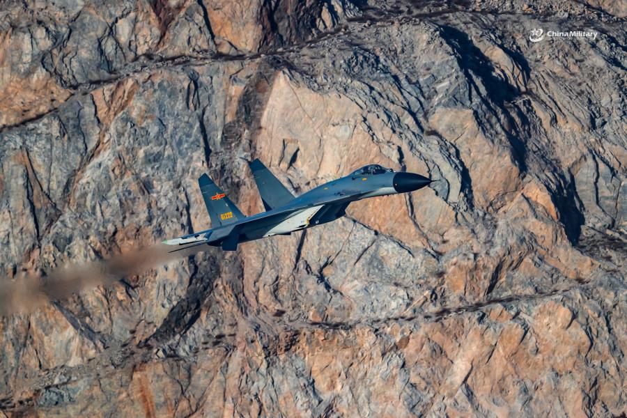 A J-11B fighter jet attached to an aviation brigade of the air force with the PLA Northern Theater Command flies at low altitude through valleys during a flight training exercise on January 8, 2019.  (Photo/eng.chinamil.com.cn)