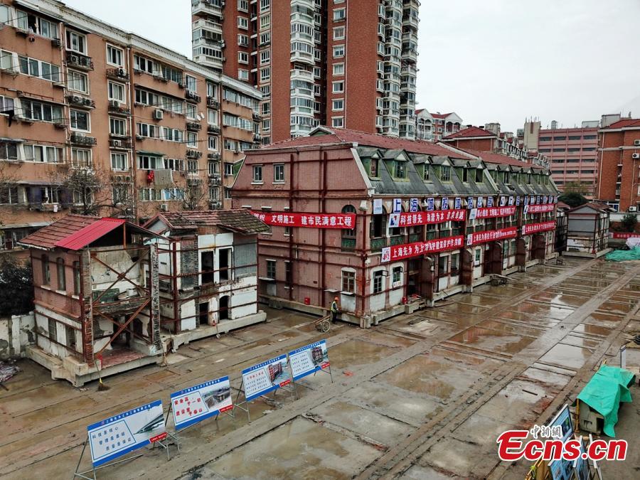 A 116-year-old building listed as a cultural relic under protection in Yangpu District of Shanghai is moved 235 meters to the east of its original location to make way for an underwater tunnel. The old house with four building units will be restored to its original location at the end of construction on the tunnel. (Photo: China News Service/Qian Ye)