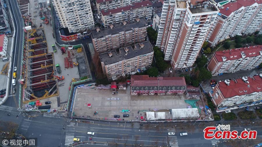 A 116-year-old building listed as a cultural relic under protection in Yangpu District of Shanghai is moved 235 meters to the east of its original location to make way for an underwater tunnel. The old house with four building units will be restored to its original location at the end of construction on the tunnel. (Photo: China News Service/Qian Ye)