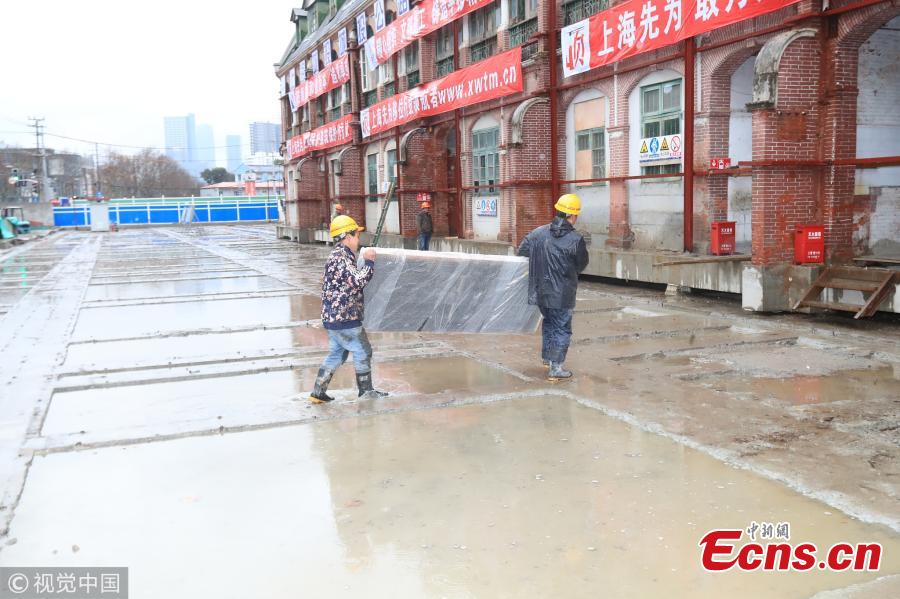 A 116-year-old building listed as a cultural relic under protection in Yangpu District of Shanghai is moved 235 meters to the east of its original location to make way for an underwater tunnel. The old house with four building units will be restored to its original location at the end of construction on the tunnel. (Photo/VCG)