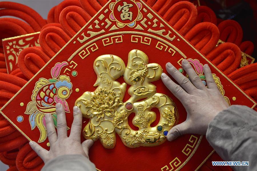 <?php echo strip_tags(addslashes(A villager makes Chinese knots in preparation for the upcoming Spring Festival in Xingtai County, north China's Hebei Province, Jan. 10, 2019. The Spring Festival, or Chinese Lunar New Year, falls on Feb. 5 this year. (Xinhua/Chen Lei))) ?>
