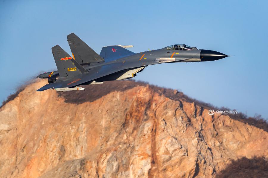 A J-11B fighter jet attached to an aviation brigade of the air force with the PLA Northern Theater Command flies at low altitude through valleys during a flight training exercise on January 8, 2019.  (Photo/eng.chinamil.com.cn)