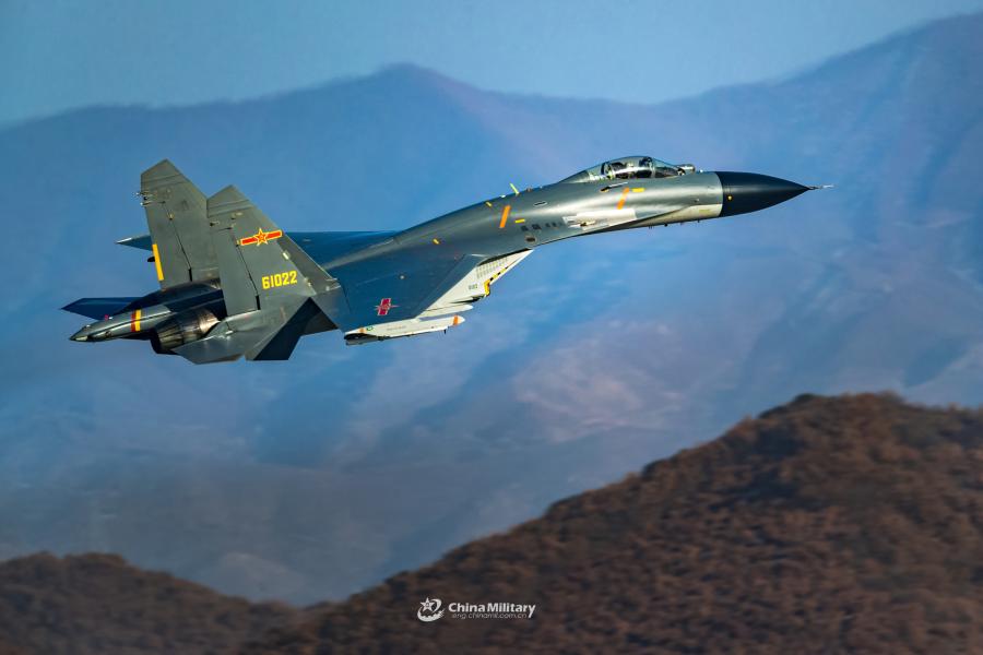 A J-11B fighter jet attached to an aviation brigade of the air force with the PLA Northern Theater Command flies at low altitude through valleys during a flight training exercise on January 8, 2019.  (Photo/eng.chinamil.com.cn)