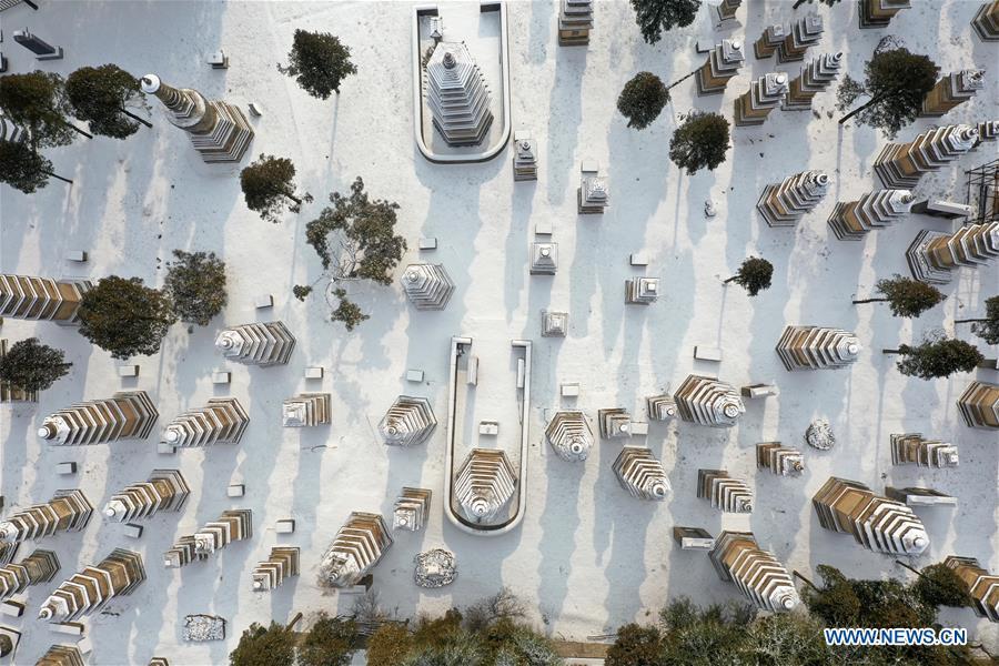 Aerial photo taken on Jan. 10, 2019 shows the snow-covered Pagoda Forest of Shaolin Temple in Dengfeng City, central China\'s Henan Province. (Xinhua/Feng Dapeng)