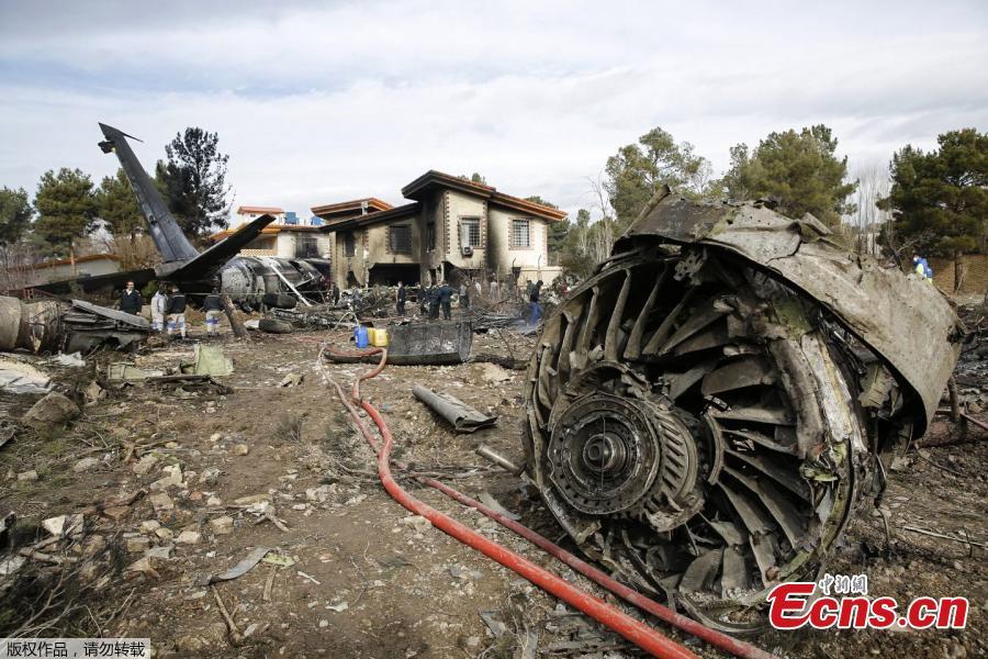 A picture taken on January 14, 2019 shows a Boeing 707 cargo plane that reportedly crashed into a residential complex near the Iranian capital Tehran with more than 10 people onboard. The plane overshot the runway during its landing, Iran\'s aviation organisation spokesman Reza Jafarzadeh told state broadcaster IRIB. (Photo/Agencies)