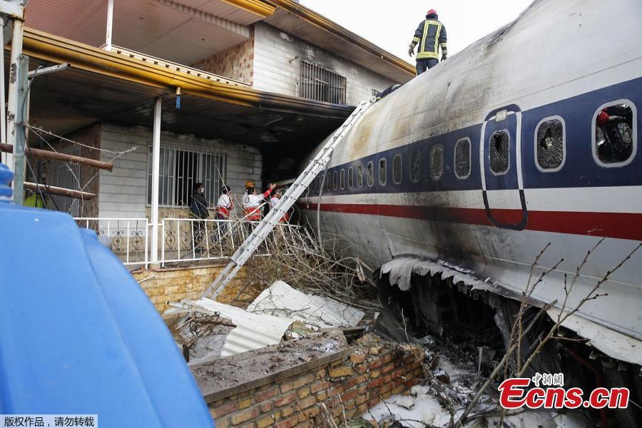 A picture taken on January 14, 2019 shows a Boeing 707 cargo plane that reportedly crashed into a residential complex near the Iranian capital Tehran with more than 10 people onboard. The plane overshot the runway during its landing, Iran\'s aviation organisation spokesman Reza Jafarzadeh told state broadcaster IRIB. (Photo/Agencies)