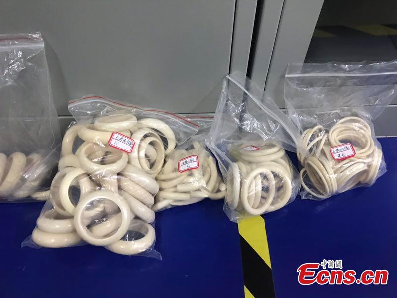 Ivory products seized by police are on display in Pujiang County, East China\'s Zhejiang Province. Local police busted a smuggling ring that made deals through social networking app WeChat, confiscating hundreds of ivory products worth more than 1 million yuan ($148,000). (Photo provided to China News Service)