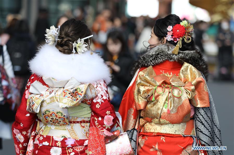 Japanese girls in kimonos celebrate Coming of Age together at Tokyo Disneyland in Chiba, Japan, Jan. 14, 2019. People who turned 20-year-old took part in the annual Coming of Age Day ceremony in Japan on Monday. (Xinhua/Du Xiaoyi)