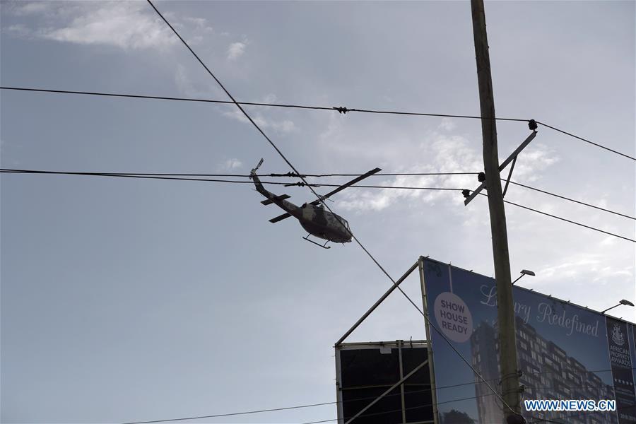 A helicopter hovers near the site of an attack at an upmarket hotel and office complex in Nairobi, Kenya, on Jan. 15, 2019. At least six people have been confirmed dead and several others injured following an attack at an upmarket hotel and office complex in Nairobi on Tuesday, police said. (Xinhua/Lyu Shuai)