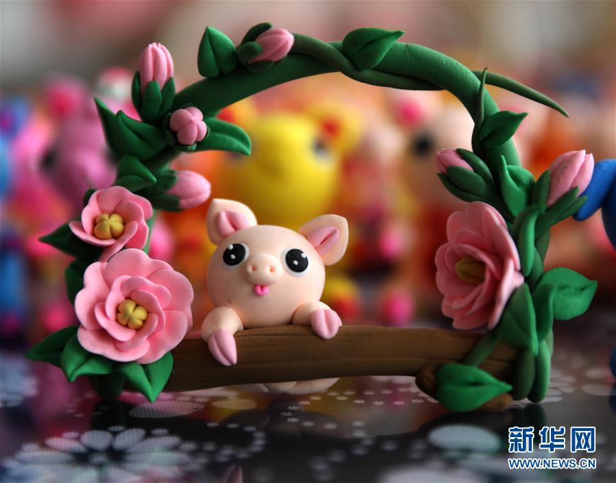 <?php echo strip_tags(addslashes(To celebrate the upcoming Year of the Pig, a Chinese folk artist created dozens of cute piggy figurines with traditional clay sculpting technique, Jan. 14, in east China's Rongcheng city, Shandong Province. (Photo/Xinhua))) ?>