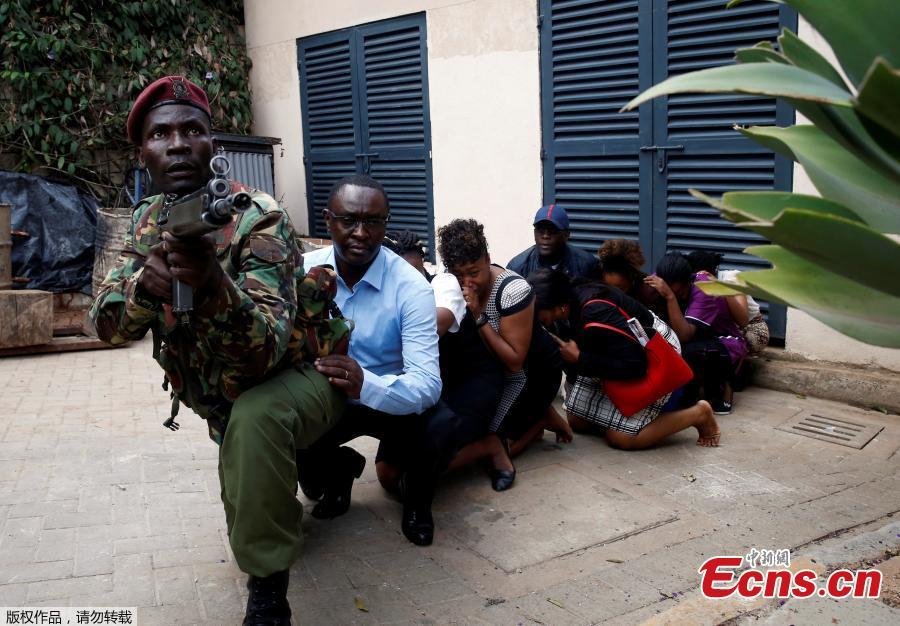 <?php echo strip_tags(addslashes(Security forces help civilians flee the scene as cars burn behind, at a hotel complex in Nairobi, Kenya Tuesday, Jan. 15, 2019. Terrorists attacked an upscale hotel complex in Kenya's capital Tuesday, sending people fleeing in panic as explosions and heavy gunfire reverberated through the neighborhood.  (Photo/Agencies))) ?>
