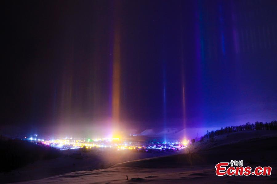 <?php echo strip_tags(addslashes(Natural light beam appears at Hemu Village, Altay, Northwest China's Xinjiang Uygur Autonomous Region as temperatures drop to 30 minus degrees. The sword-like light beam straight into the starry sky is a natural phenomenon, the reflection of ice crystals in the cold night air. (Photo: China News Service/Lei Dongxiang))) ?>