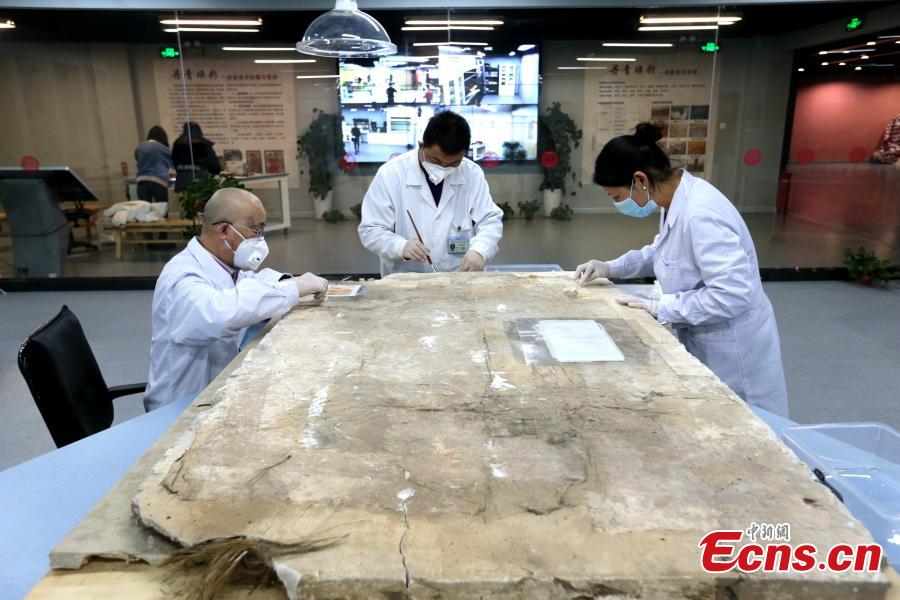 <?php echo strip_tags(addslashes(An ancient mural undergoes restoration work in a room at the Shaanxi History Museum in Xi'an, Northwest China's Shaanxi Province, Jan. 16, 2019. Visitors can view the process through a glass window. (Photo: China News Service/Zhang Yuan))) ?>