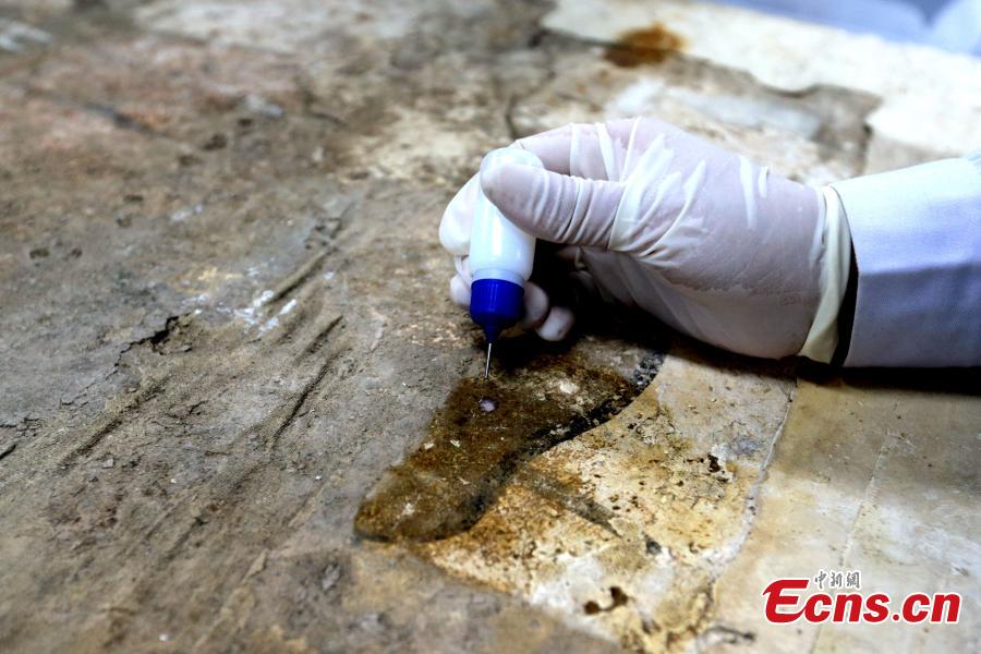 <?php echo strip_tags(addslashes(An ancient mural undergoes restoration work in a room at the Shaanxi History Museum in Xi'an, Northwest China's Shaanxi Province, Jan. 16, 2019. Visitors can view the process through a glass window. (Photo: China News Service/Zhang Yuan))) ?>