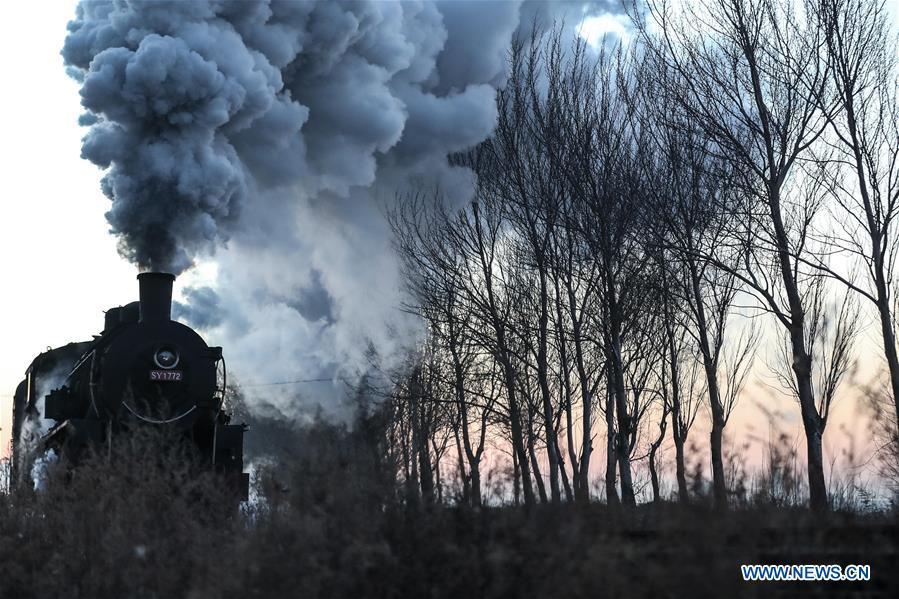 Photo taken on Jan. 17, 2019 shows a steam locomotive heading to the steam locomotive museum of Tiefa Energy Co., Ltd from Diaobingshan Station, northeast China\'s Liaoning Province. A 5-day steam locomotive tourism event kicked off in Diaobingshan on Thursday. Tourists can visit the steam locomotive museum, take pictures of steam locomotives and watch exhibitions during the event. (Xinhua/Pan Yulong)
