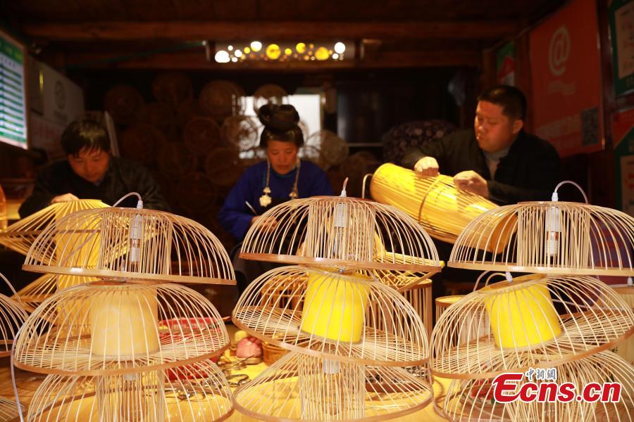 Villagers make bird cage-shaped lanterns, to be used in Chinese New Year celebrations, in Kala Village, Danzhai County, Southwest China’s Guizhou Province, Jan. 17, 2019. Wang Yuhe is a master of the craft, recognized as an intangible cultural heritage by the province in 2008. The village is famous for producing bird cage-shaped lanterns. (Photo: China News Service/Huang Xiaohai)