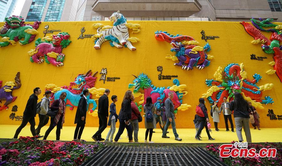 A shopping mall in Causeway Bay, Hong Kong, has set up a giant wall of auspicious animals at its gate to welcome the Chinese Lunar New Year. (Photo: China News Service/Zhang Wei)