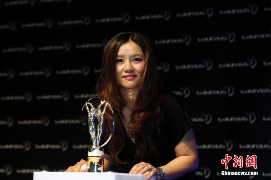 Li Na receives the Laureus Exceptional Achievement Award in Shanghai in 2015. (Photo/Agencies)