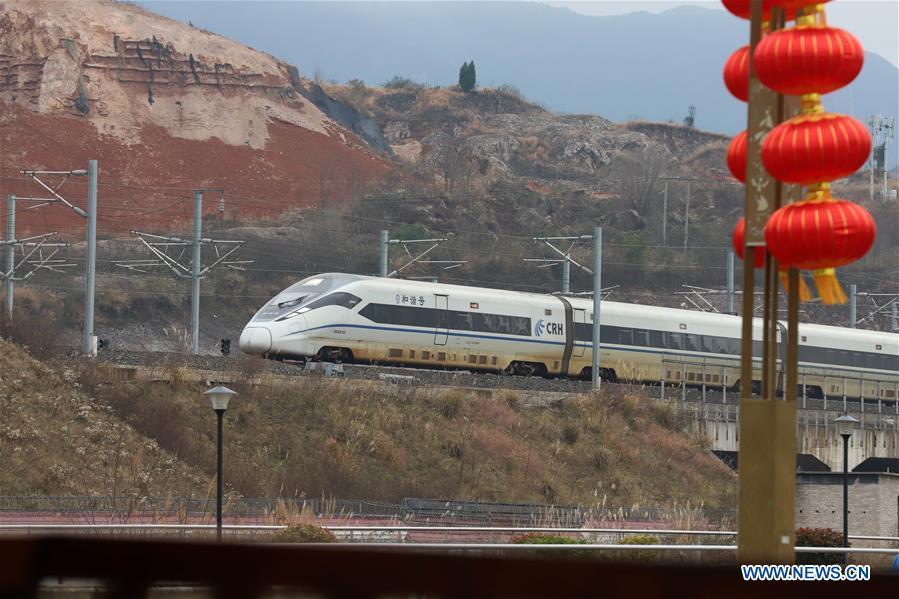 A bullet train runs in Kaili City, southwest China\'s Guizhou Province, Jan. 20, 2019. The 2019 Spring Festival travel rush, known as Chunyun, starts on Jan. 21. The Spring Festival, or Chinese Lunar New Year, falls on Feb. 5 this year. (Xinhua/Wu Jibin)